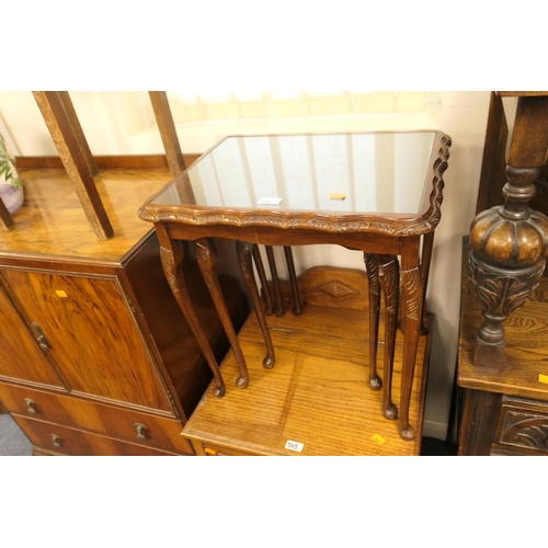 566 - Nest of stained beech and glass topped occasional tables