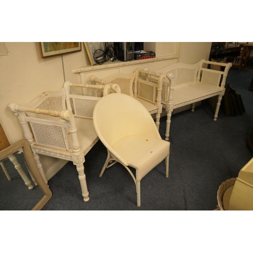 591 - White painted and wicker backed window seat with matching armchairs; also a Lloyd Loom style basket ... 