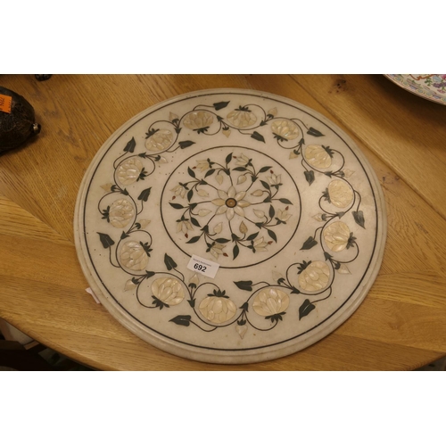 692 - Marble and mother-of-pearl inlaid circular table top, 43cm diameter