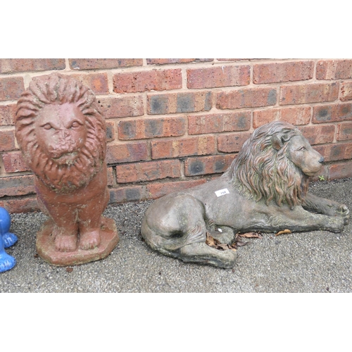 759 - Reconstituted stone garden ornament of a recumbent lion and a further lion ornament (2)