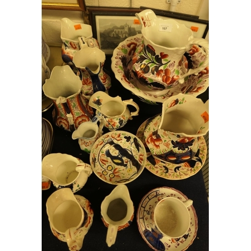 107 - Collection of early Victorian Gaudy Welsh including a jug and bowl, milk jugs, saucers and a mug etc... 