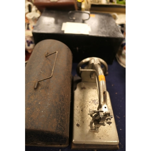 158 - Metal strongbox with key; also vintage hand cranked sewing machine (2)