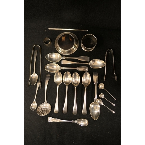 322 - Mixed silver wares including George III bright cut sugar tongs, London 1792, various silver spoons, ... 