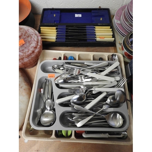 39 - Cased moulded handled butter knives and two trays of household cutlery