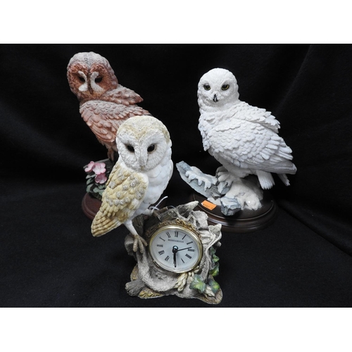 111 - Three Brooks & Bentley hand finished owl ornaments, the largest 27cm