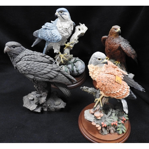 128 - Four Brooks & Bentley hand finished resin figures of birds of prey, the largest 28cm