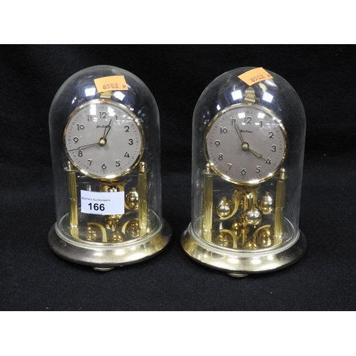 166 - Two brass anniversary clocks