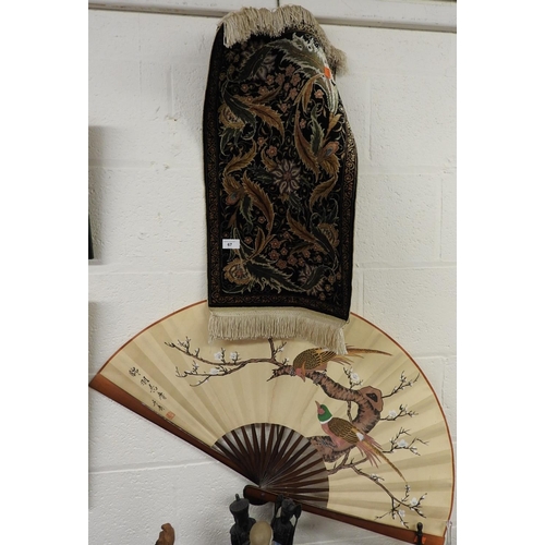 67 - Turkish Cinar silk wall hanging, 65cm x 37cm; also an Oriental painted fan (2)