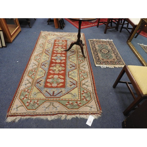 677 - Hamadan woollen rug, 228cm x 118cm, also a small green ground woollen rug (2)