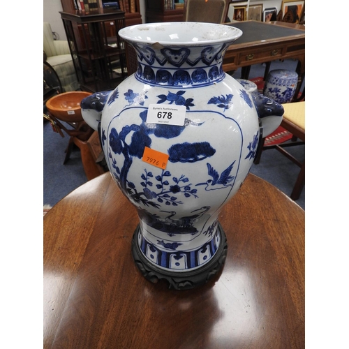 678 - Oriental blue and white vase on wooden stand