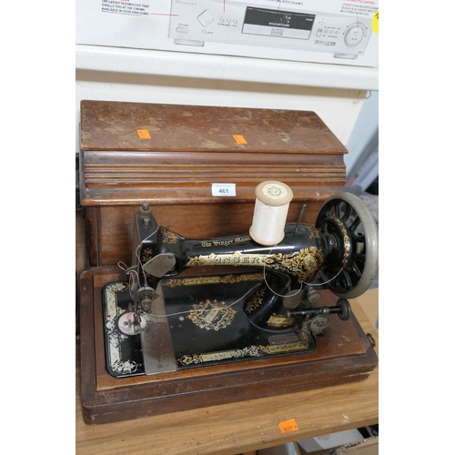 461 - Walnut cased hand cranked Singer sewing machine