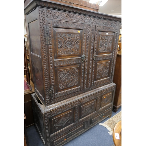 532 - carved oak press cupboard, 18th Century and later, width 136cm, height 179cm