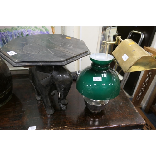 557 - Carved ebony elephant stand, paraffin lamp and a brass reading lamp (3)