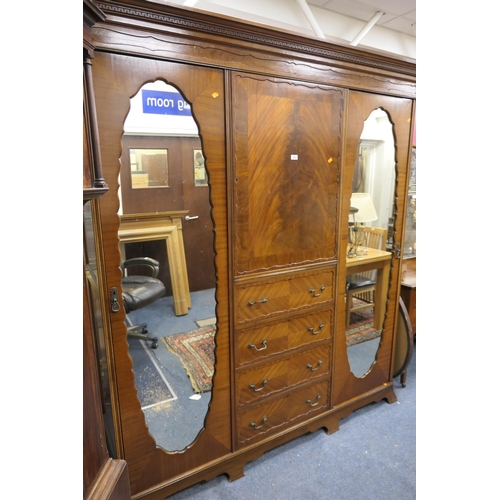 676 - Edwardian mahogany triple wardrobe with double mirrors and chest centre, 192cm x 213cm