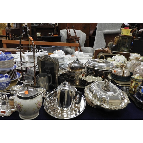 120 - Assorted silver plated wares including a Dresser style cruet serving tray, muffin warming dish, chee... 