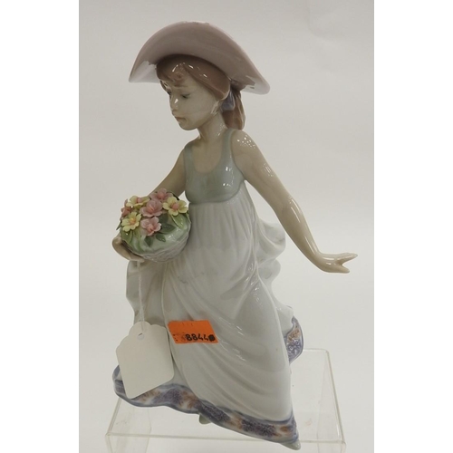 150 - Lladro figure of a young lady holding a basket of flowers