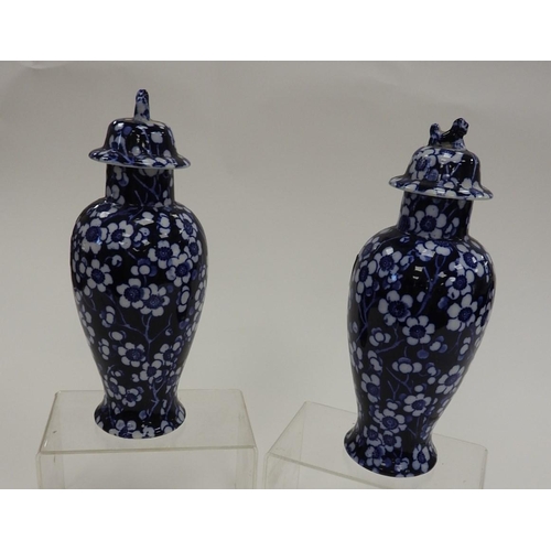 163 - Pair of Wood's Prunus pattern lidded vases