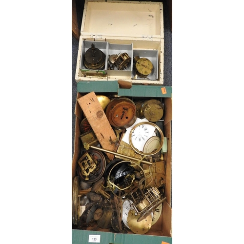 123 - Assorted clock spares including faces, mechanisms, cuckoo clock weights etc. (1 box)