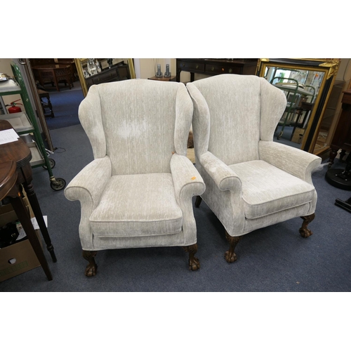 446 - Pair of traditional fabric upholstered wing armchairs on claw and ball feet