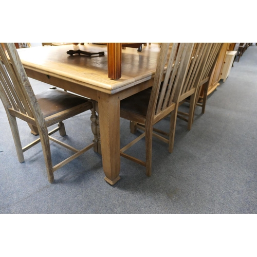 569 - Light oak extendable dining table, length 181cm, width 122cm, together with four slat back dining ch... 