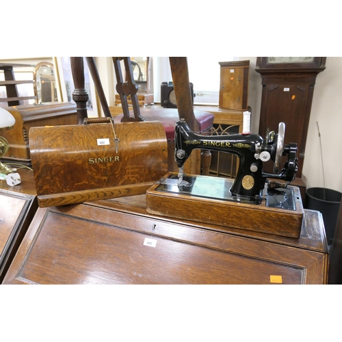 602 - Oak cased Singer hand cranked sewing machine