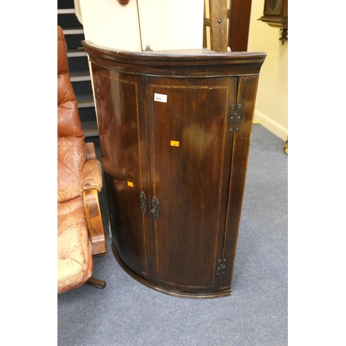 676 - Early 19th Century oak and inlaid bow front hanging corner cupboard