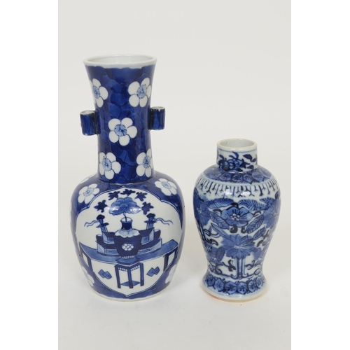 103 - Chinese blue and white bottle vase, late 19th Century, decorated with panels featuring a table and o... 