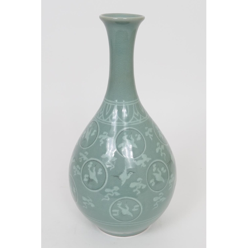 115 - Korean celadon bottle vase, decorated with flying egrets against a crackle green ground, height 31.5... 