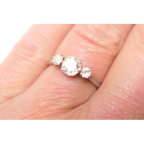 346 - Diamond three stone ring, the central old round cut diamond of approx. 0.7ct flanked by two small ol... 