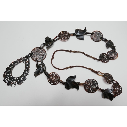 379 - Victorian carved tortoiseshell pendant necklace, worked with pierced foliate discs dispersed with ca... 