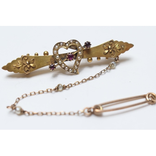 494 - Edwardian 15ct gold lovehearts brooch, Chester 1902, centred with a heart bordered with seed pearls ... 