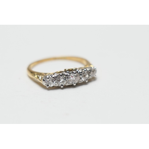 495 - 18ct gold diamond five stone ring, old round cut diamonds within scroll mounts on a yellow gold ring... 