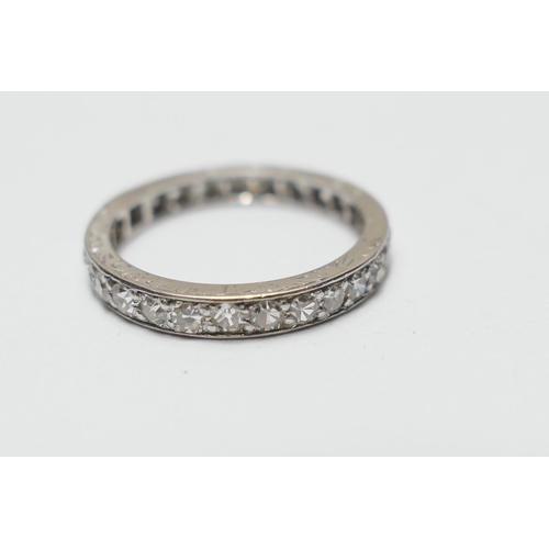 509 - Diamond eternity ring, the small round cut stones channel set in platinum, size K, gross weight appr... 