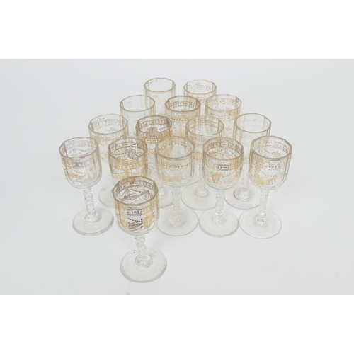 59 - Fifteen Regency gilded and faceted wine glasses, early 19th Century, the bowls decorated with ribbon... 