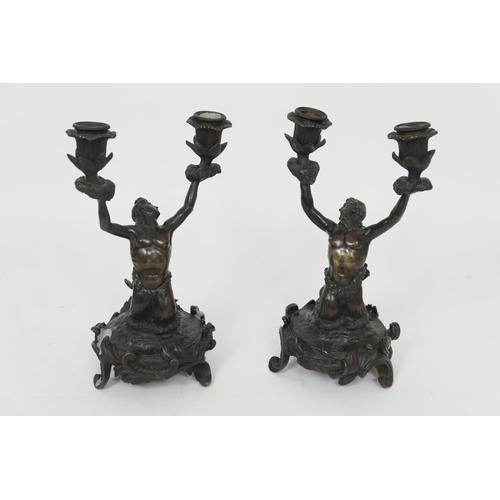 630 - Pair of bronze candlesticks in the manner of John Flaxman, early 19th Century, each cast as a merman... 