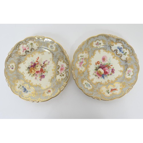 48 - Pair of Coalport sandwich plates, decorated with a floral bouquet, bordered with gilt, painted flora... 