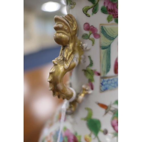 147 - Cantonese famille rose vase, mid 19th Century, with dragon handles, decorated with panels of figures... 