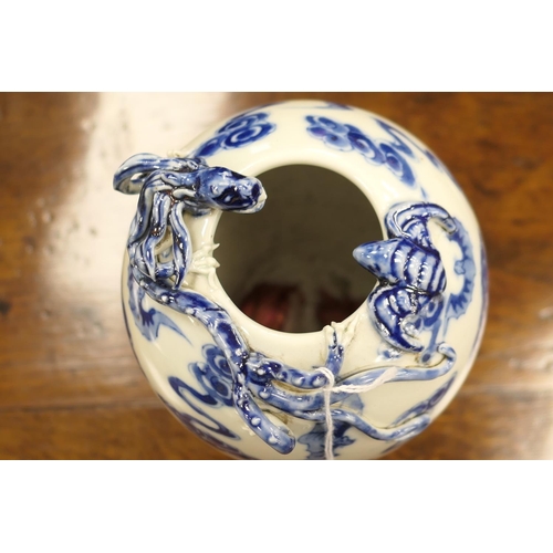 31 - Chinese blue and white ovoid vase, late 19th Century, having applied dragon and bat at the inverted ... 