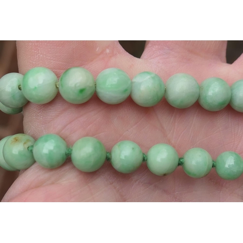 507 - Red coral bead necklace, 53cm; also a spinach green nephrite beaded necklace, 50cm; an apple green j... 