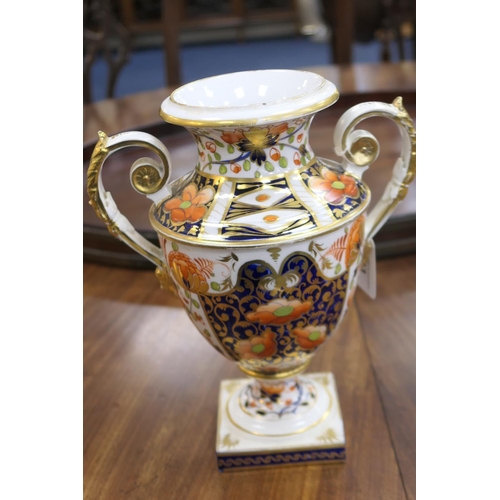 83 - Derby imari porcelain garniture, circa 1800-25, each of twin handled urn shape, decorated in typical... 