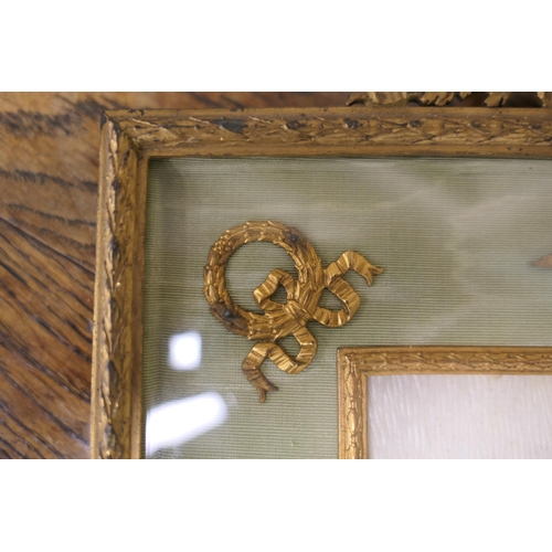 669 - French Empire Revival brass photograph frame, aperture size 14.5cm x 10.5cm, the frame 18cm x 20cm