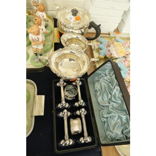 30 - Elkington silver plated three piece tea service; also Cased set comprising four silver plated cutler... 