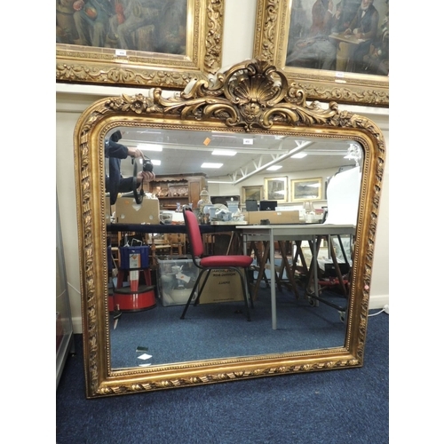 452 - Decorative gilt moulded over mantel mirror in the Baroque style, width 131cm, height 136cm