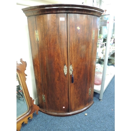 454 - Georgian mahogany bow front hanging corner cupboard fitted with three shelves, height 108cm