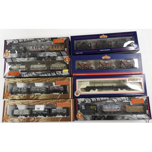 166 - Bachmann 00 gauge rolling stock, comprising seven wagon triple packs and a bogey bolster wagon (all ... 