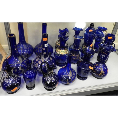 201 - Collection of Victorian and later decorated blue glassware including numerous vases, bottles, jugs (... 