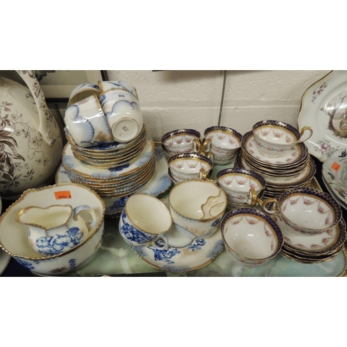 80 - Aynsley gilt printed and blue ground floral decorated tea service and a further china tea service (1... 