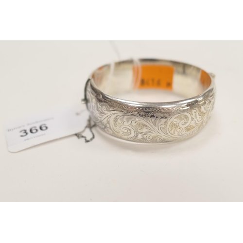 366 - Silver and scroll engraved hinged bangle