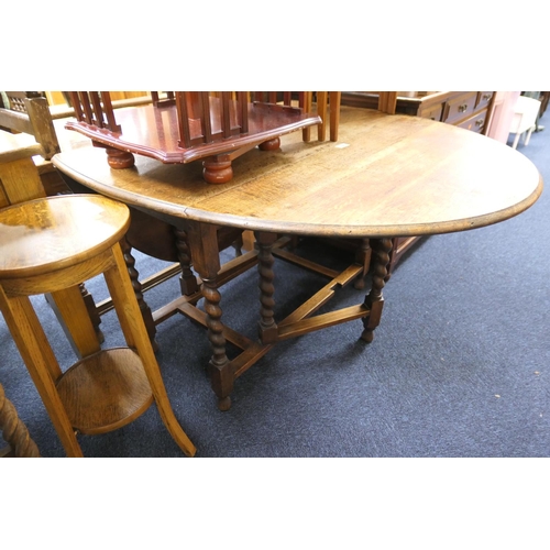 488 - Oak barley twist gateleg table, 102cm