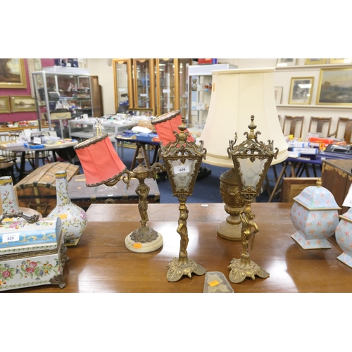 629 - Pair of decorative brass figural lamps, further figural lamp and an urn shaped lamp (4)